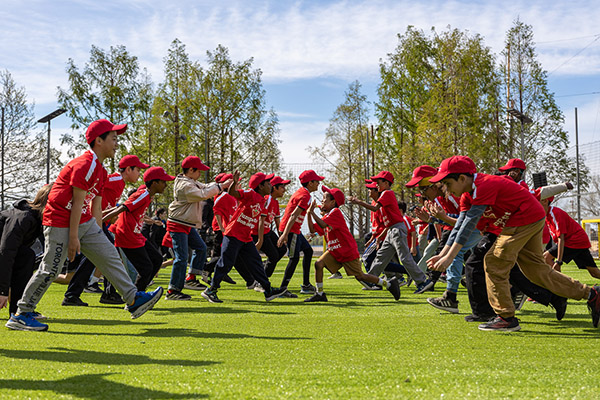Kids playing soccer on the pitch