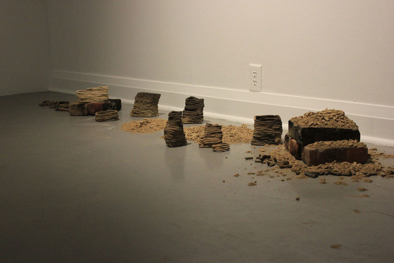 Art installation of raw clay on the floor