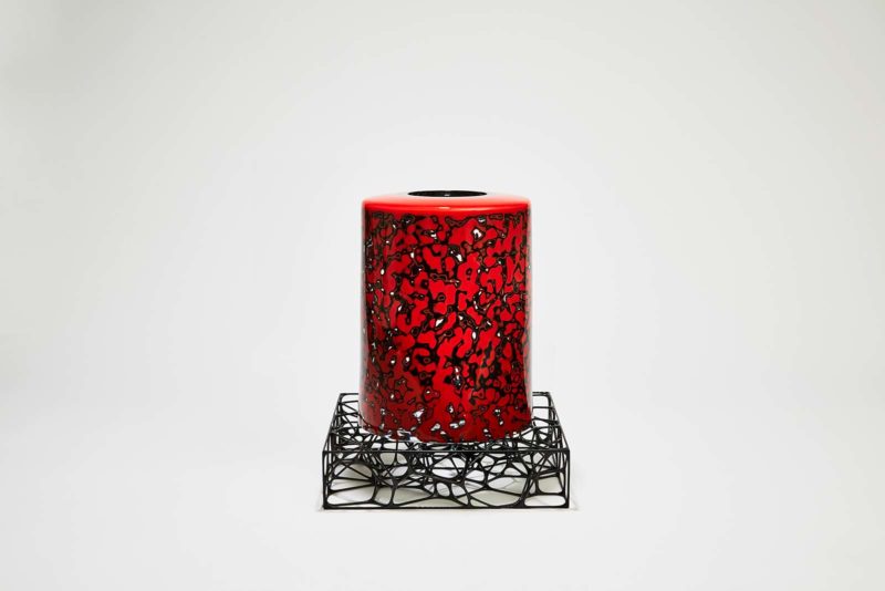 red candle on a stand