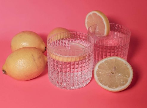 lemons around two glass cups