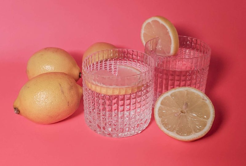 lemons around two glass cups