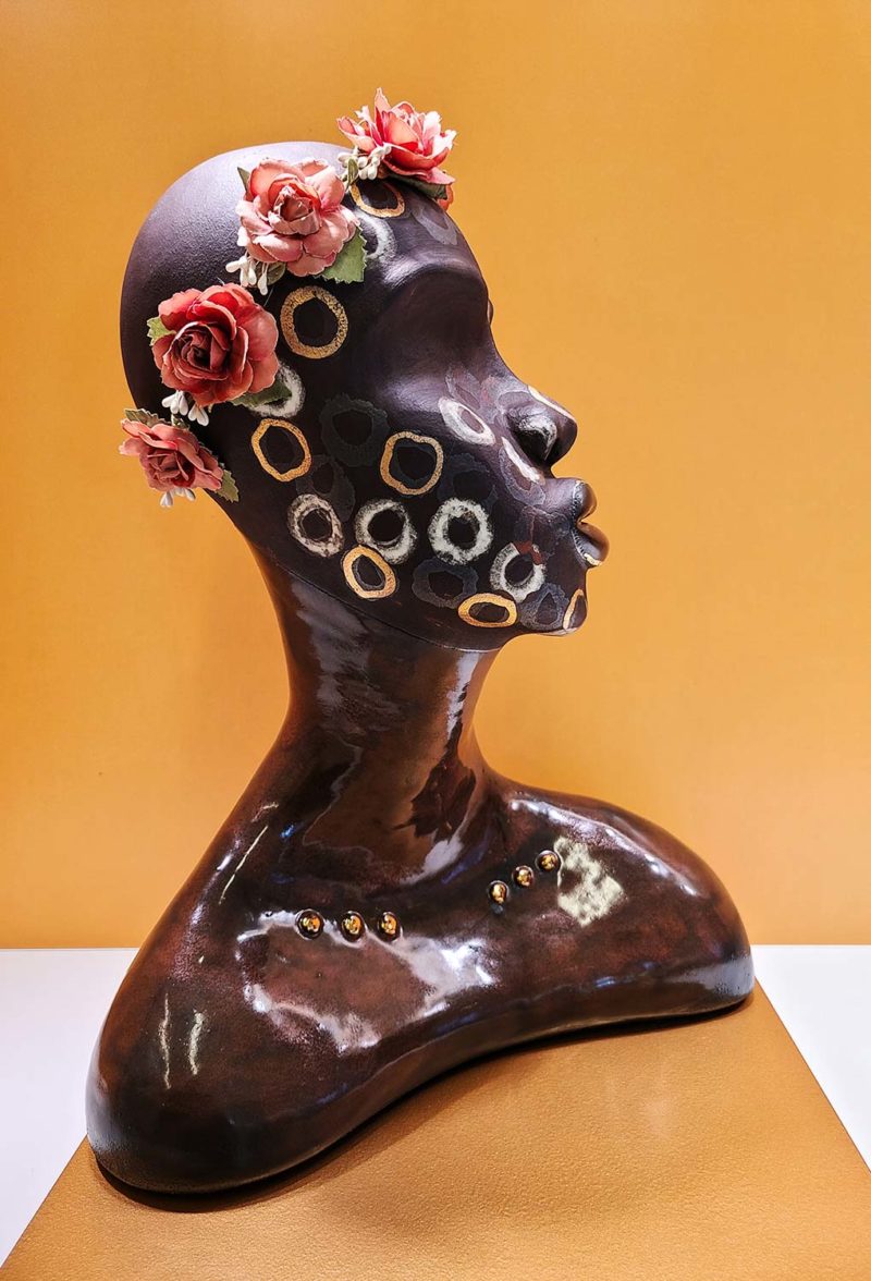 sculpture wearing a flower crown
