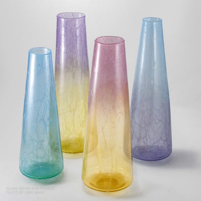 four coloured vases