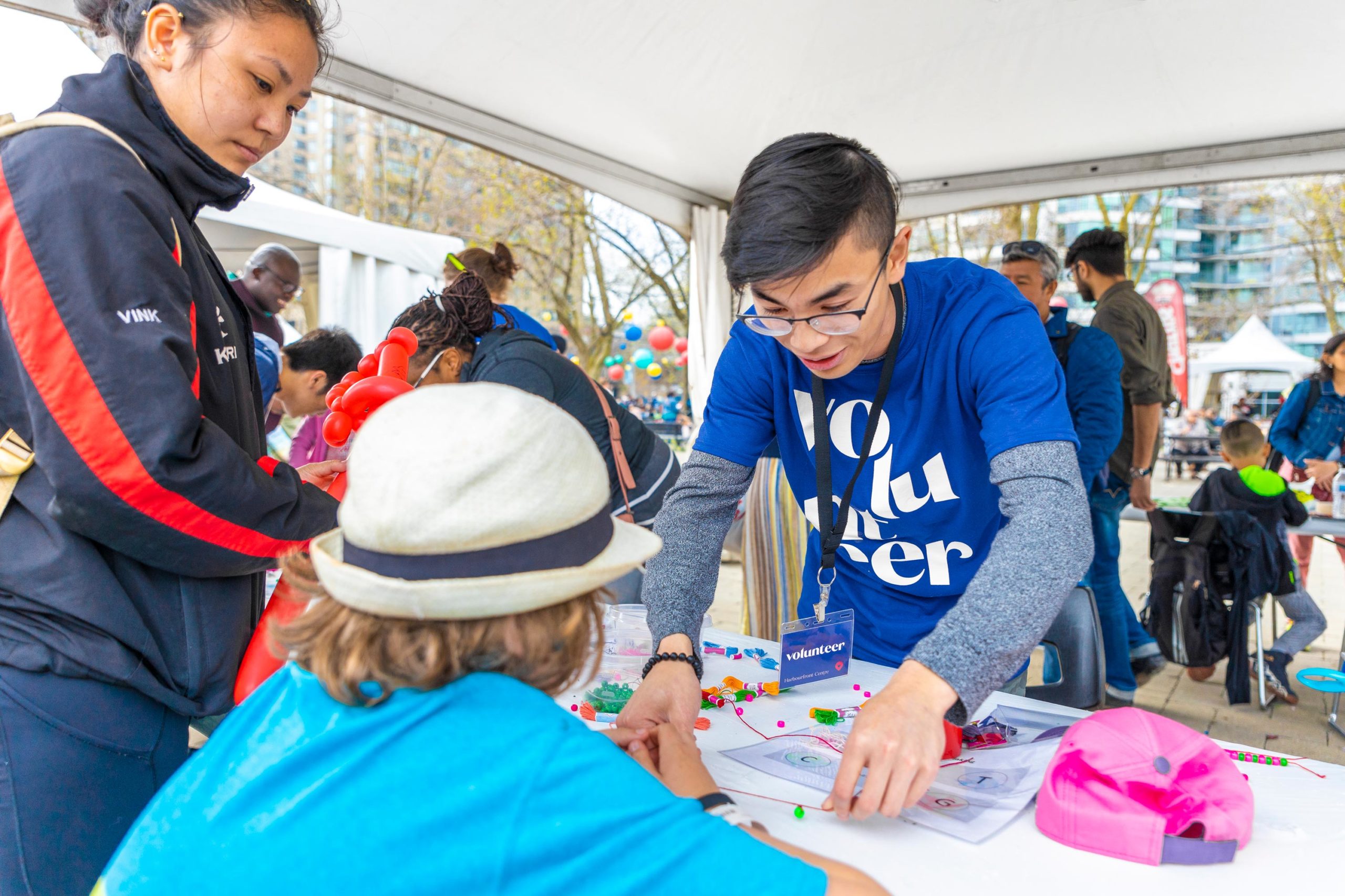 man helping a child with a craft