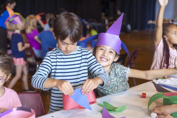 Two children doing arts and crafts at camp