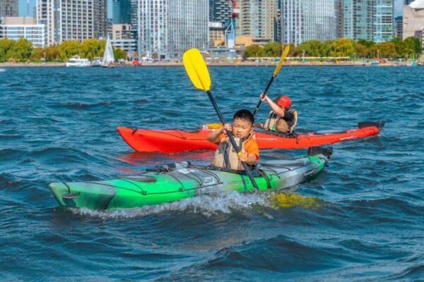 Young boy kayaking on a lake