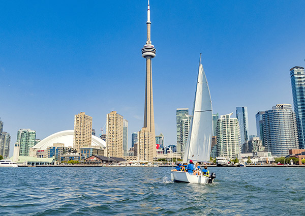 kids on a sailboat in the lake off Toronto