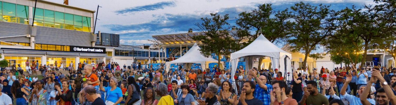 Crowd at a summer festival outdoors.