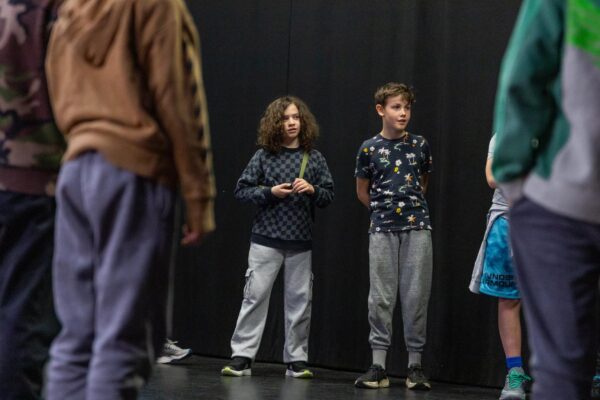 A group of students learning theatre improv