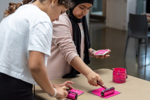 Two students doing a lino craft