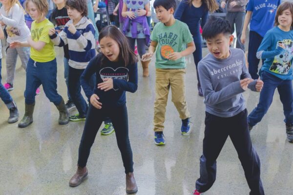 Excited young students practicing their Hip Hop moves