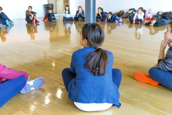 A group of students sitting in a circle