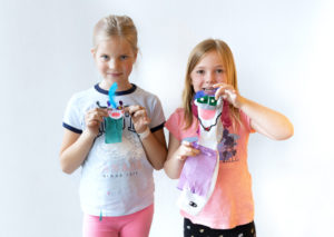 Two students showing us their sock puppets