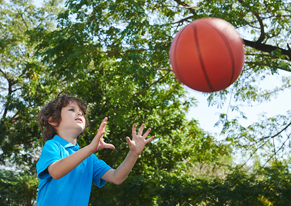 Child playing with a basketball