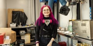 Artist working on glass craft in studio