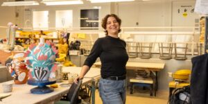Artist working on ceramic craft in studio