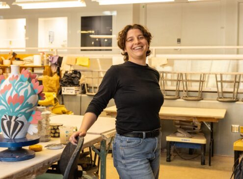 Artist working on ceramic craft in studio