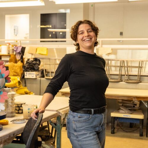 Artist working on ceramic craft in studio