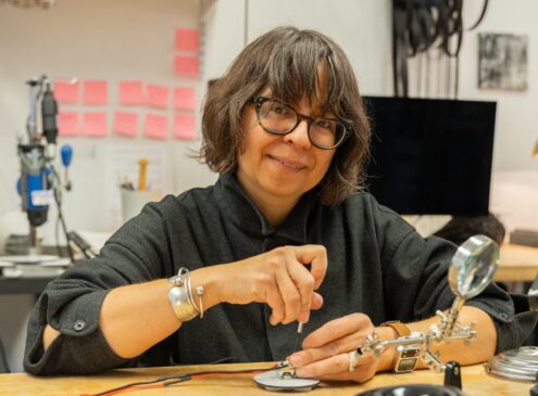 Artist working on design craft in studio