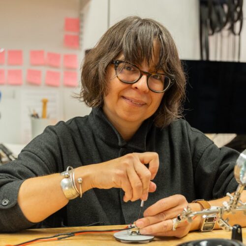 Artist working on design craft in studio