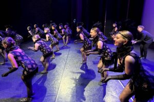 Group of dancers on stage.