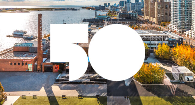 White 50 icon against a Toronto waterfront backdrop.