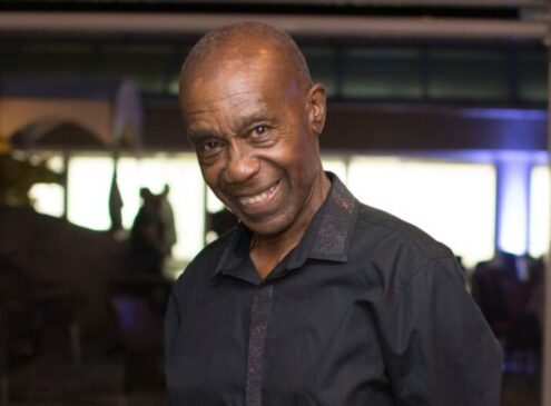 Man wearing a black shirt posing for the camera.