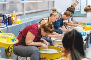 Group of students in a ceramics class workshop