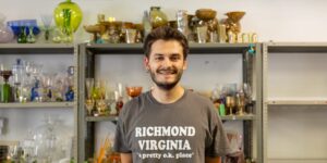 Artist working onglass craft in studio