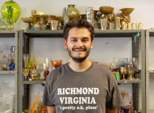 Artist working onglass craft in studio