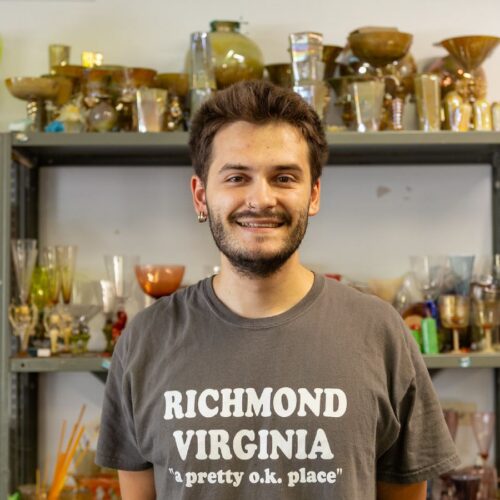 Artist working onglass craft in studio