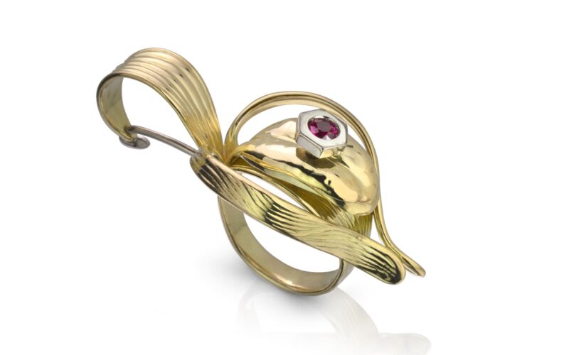 Gold ring against white background