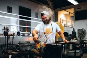 Man glassblowing in a glass studio