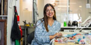 Artist working on textile craft in studio