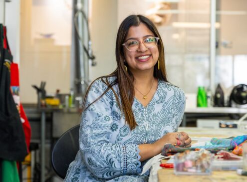 Artist working on textile craft in studio