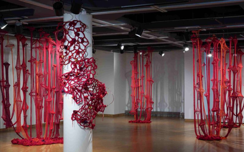 Red textile work in an exhibition