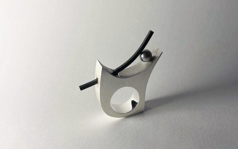 Metal jewellery against white background