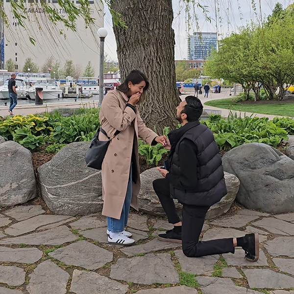 Amreet proposing to Camille by tree
