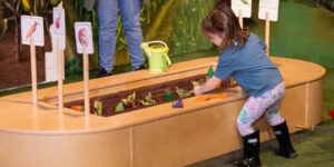 Girl playing with toys in a room
