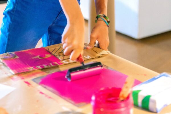 Young girl working on their art print