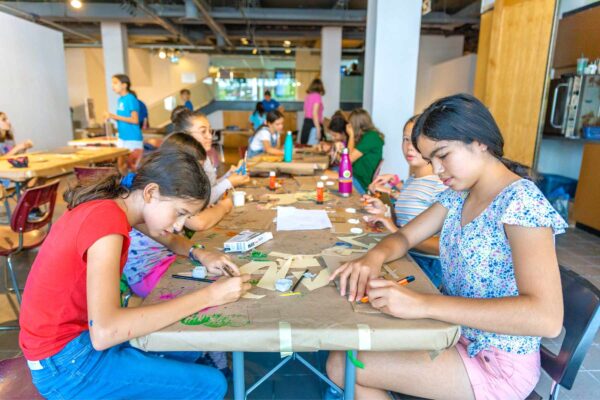 Group of girls doing arts and crafts at camp