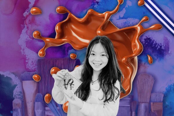 A girl holding a chocolate painted artwork against a purple blue background