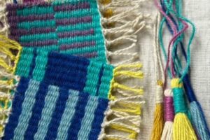A close-up shot of woven colourful fabric