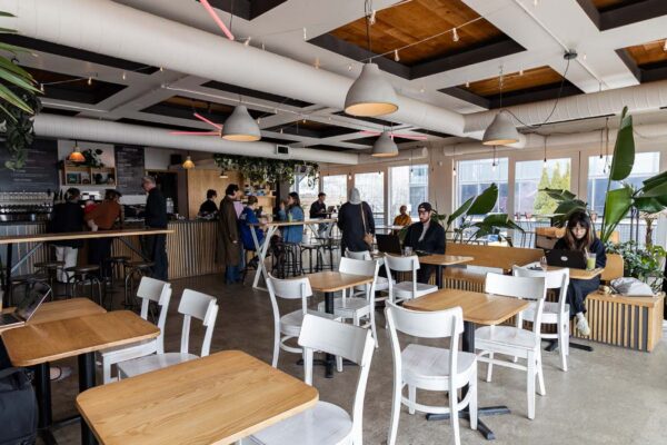 The interior of a restaurant with tables and chairs
