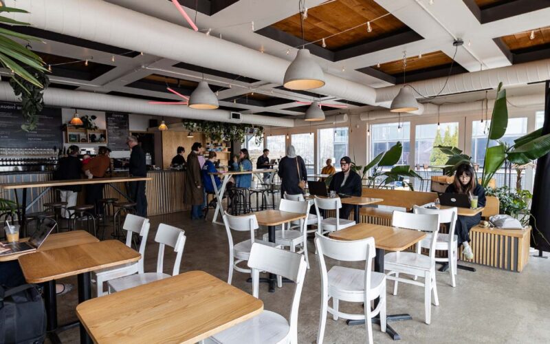 The interior of a restaurant with tables and chairs