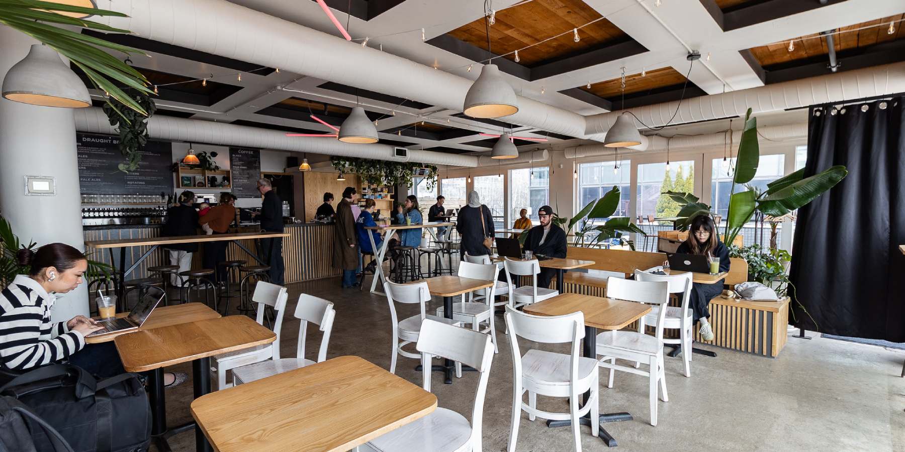 The interior of a restaurant with tables and chairs