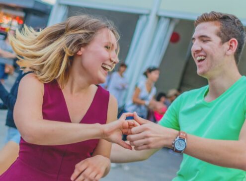 A couple dancing outside