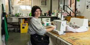 Artist working on textile craft in studio
