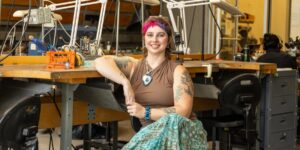 Artist working on metal craft in studio