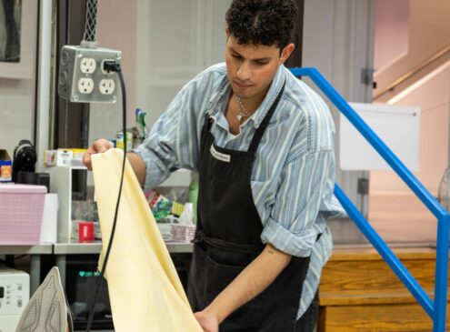 Artist working on textile craft in studio